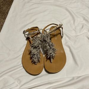 City classified sandal with fringe detail and ankle strap closure